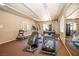 Well-equipped fitness center with treadmills, elliptical, and mirrored wall at 2151 Hussium Hills St # 207, Las Vegas, NV 89108