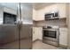 Kitchen showcasing stainless steel appliances and wood-style flooring at 2151 Hussium Hills St # 207, Las Vegas, NV 89108