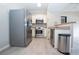 Kitchen with stainless steel appliances and breakfast bar at 2151 Hussium Hills St # 207, Las Vegas, NV 89108