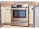 Stainless steel Frigidaire oven with white cabinetry complements the kitchen at 2151 Hussium Hills St # 207, Las Vegas, NV 89108