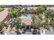 Aerial image of a community pool and spa with lush landscaping creating a relaxing oasis for residents at 2151 Hussium Hills St # 207, Las Vegas, NV 89108