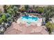 Community pool and hot tub, surrounded by lush landscaping and offering a tranquil retreat at 2151 Hussium Hills St # 207, Las Vegas, NV 89108