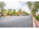 View of the entrance of an apartment complex surrounded by greenery at 2151 Hussium Hills St # 207, Las Vegas, NV 89108