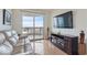 Comfortable living room with a fireplace and city views at 322 Karen Ave # 2007, Las Vegas, NV 89109