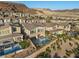 Aerial view of homes with private pools and mountain backdrop at 31 Vista Outlook St, Henderson, NV 89011