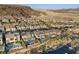 Aerial view of neighborhood with modern homes and desert landscape at 31 Vista Outlook St, Henderson, NV 89011