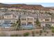 Aerial view of a luxury home with a pool and mountain views at 31 Vista Outlook St, Henderson, NV 89011