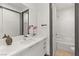 Modern bathroom with white vanity, bathtub, and updated fixtures at 31 Vista Outlook St, Henderson, NV 89011