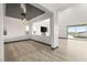 Bright dining room with modern light fixture and hardwood floors at 31 Vista Outlook St, Henderson, NV 89011