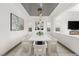 Bright dining room with modern chandelier and seating for six at 31 Vista Outlook St, Henderson, NV 89011