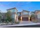 Modern home's exterior boasts a sleek design and landscaped front yard at 31 Vista Outlook St, Henderson, NV 89011