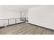 Spacious loft with wood-look floors and modern metal railing at 31 Vista Outlook St, Henderson, NV 89011