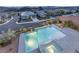 Elevated view of a modern pool and spa at dusk at 31 Vista Outlook St, Henderson, NV 89011