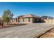 Single-story home with a large yard and attached garage at 3780 Shawnee Ave, Pahrump, NV 89048