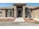 Front entrance with arched entryway and fountain at 3780 Shawnee Ave, Pahrump, NV 89048