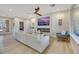 Light-filled living room with comfortable seating and a built-in fireplace at 4660 Fiore Bella Blvd, Las Vegas, NV 89135