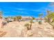 Backyard view of house, pool, and expansive desert lot at 5527 Breecher Ave, Las Vegas, NV 89131