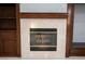 Elegant fireplace with marble surround and built-in shelving at 5527 Breecher Ave, Las Vegas, NV 89131