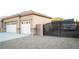 Three car garage with extra storage space and gate at 5527 Breecher Ave, Las Vegas, NV 89131