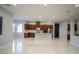 Open kitchen boasts modern cabinetry, stainless steel appliances, and an island at 5527 Breecher Ave, Las Vegas, NV 89131