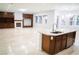 Island kitchen with breakfast bar and white countertops at 5527 Breecher Ave, Las Vegas, NV 89131