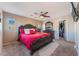 Spacious bedroom with large bed, walk-in closet, and ceiling fan at 9017 Exultation Ct, Las Vegas, NV 89149