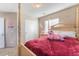 Charming bedroom with a four-poster bed and a unicorn toy at 9017 Exultation Ct, Las Vegas, NV 89149