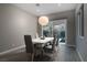 Dining room featuring modern lighting and sliding glass doors to outdoor living space at 11 Via Tavolara, Henderson, NV 89011