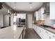 Stylish kitchen featuring granite countertops, stainless steel appliances, and custom cabinetry at 11 Via Tavolara, Henderson, NV 89011