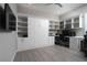 Stylish home office featuring custom built-in shelving, cabinets, Murphy bed, and integrated workspace at 11 Via Tavolara, Henderson, NV 89011