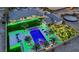 Aerial view of a luxury property with a large pool, putting green, and landscaping at 4160 W Ford Ave, Las Vegas, NV 89139