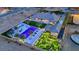 Aerial view of the house and backyard amenities at night at 4160 W Ford Ave, Las Vegas, NV 89139