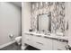 Modern bathroom with a floating vanity, marble countertop, and stylish mosaic tile at 4160 W Ford Ave, Las Vegas, NV 89139
