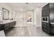 Luxurious bathroom with a large walk-in shower and modern vanity at 4160 W Ford Ave, Las Vegas, NV 89139
