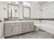 Clean bathroom with double vanity and bathtub at 4160 W Ford Ave, Las Vegas, NV 89139