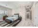Bright bedroom with wood-like flooring, a comfy bed, and ample closet space at 4160 W Ford Ave, Las Vegas, NV 89139