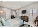 Spacious bedroom with a large bed, dresser, and plenty of natural light at 4160 W Ford Ave, Las Vegas, NV 89139