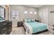 Comfortable bedroom with a queen bed, dresser, and plenty of natural light at 4160 W Ford Ave, Las Vegas, NV 89139