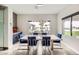 Breakfast nook with blue chairs and view of backyard at 4160 W Ford Ave, Las Vegas, NV 89139