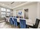 Spacious dining room with large marble table and blue chairs at 4160 W Ford Ave, Las Vegas, NV 89139