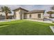 Landscaped backyard with artificial turf and a large garage at 4160 W Ford Ave, Las Vegas, NV 89139