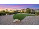 Landscaped front yard with artificial turf and stone accents at 4160 W Ford Ave, Las Vegas, NV 89139