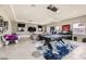 Game room with pool table, air hockey, multiple TVs, and comfortable seating at 4160 W Ford Ave, Las Vegas, NV 89139