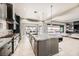 Open concept kitchen with marble island and stainless steel appliances at 4160 W Ford Ave, Las Vegas, NV 89139