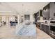 Modern kitchen with large marble island and dark cabinets at 4160 W Ford Ave, Las Vegas, NV 89139