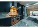 Modern kitchen features a gas cooktop, custom cabinetry, and a stylish backsplash at 4160 W Ford Ave, Las Vegas, NV 89139