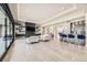 Open concept living area with large windows and a modern fireplace at 4160 W Ford Ave, Las Vegas, NV 89139