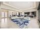Spacious living room with open floor plan and stylish rug at 4160 W Ford Ave, Las Vegas, NV 89139