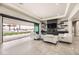 Bright and airy living room with large windows and a view of the pool at 4160 W Ford Ave, Las Vegas, NV 89139