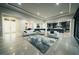 Open floor plan living room with access to kitchen and entryway at 4160 W Ford Ave, Las Vegas, NV 89139